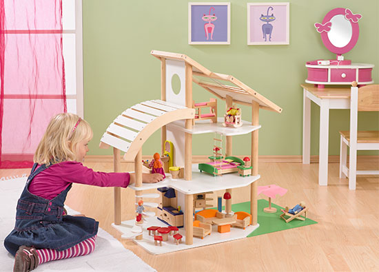 Im Rollenspiel mit dem Puppenhaus erlangen Kinder Sozialkompetenz.
